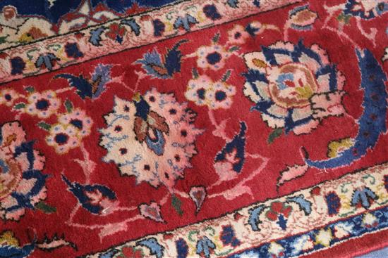 An Isfahan ivory ground carpet 340 x 235cm